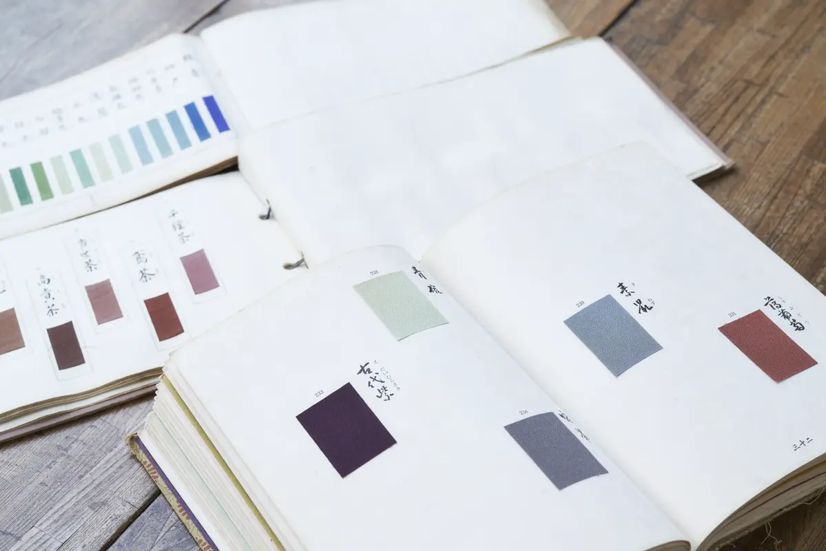 Colour sample books with swatches of dyed silk