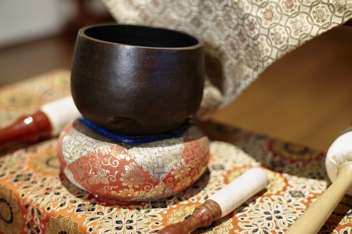 A standing bell on its cushion