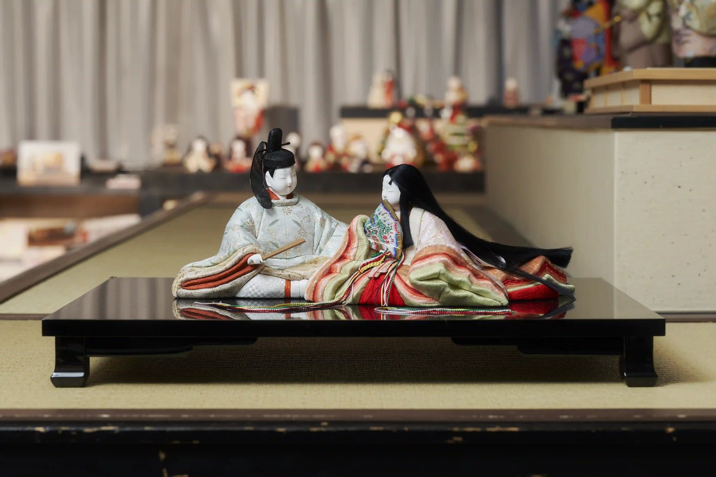 A pair of hina dolls in layered court robes