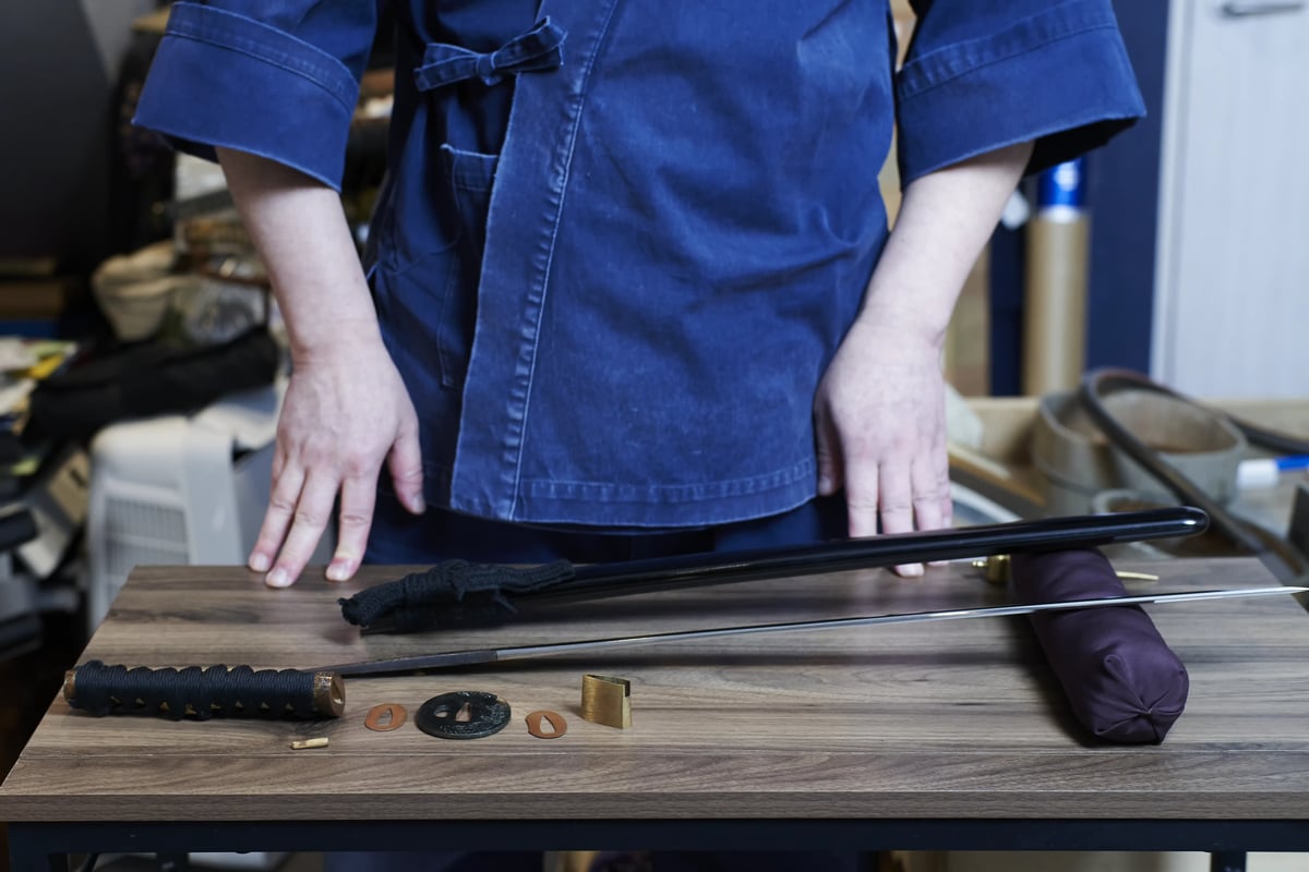 A sword taken apart on the bench