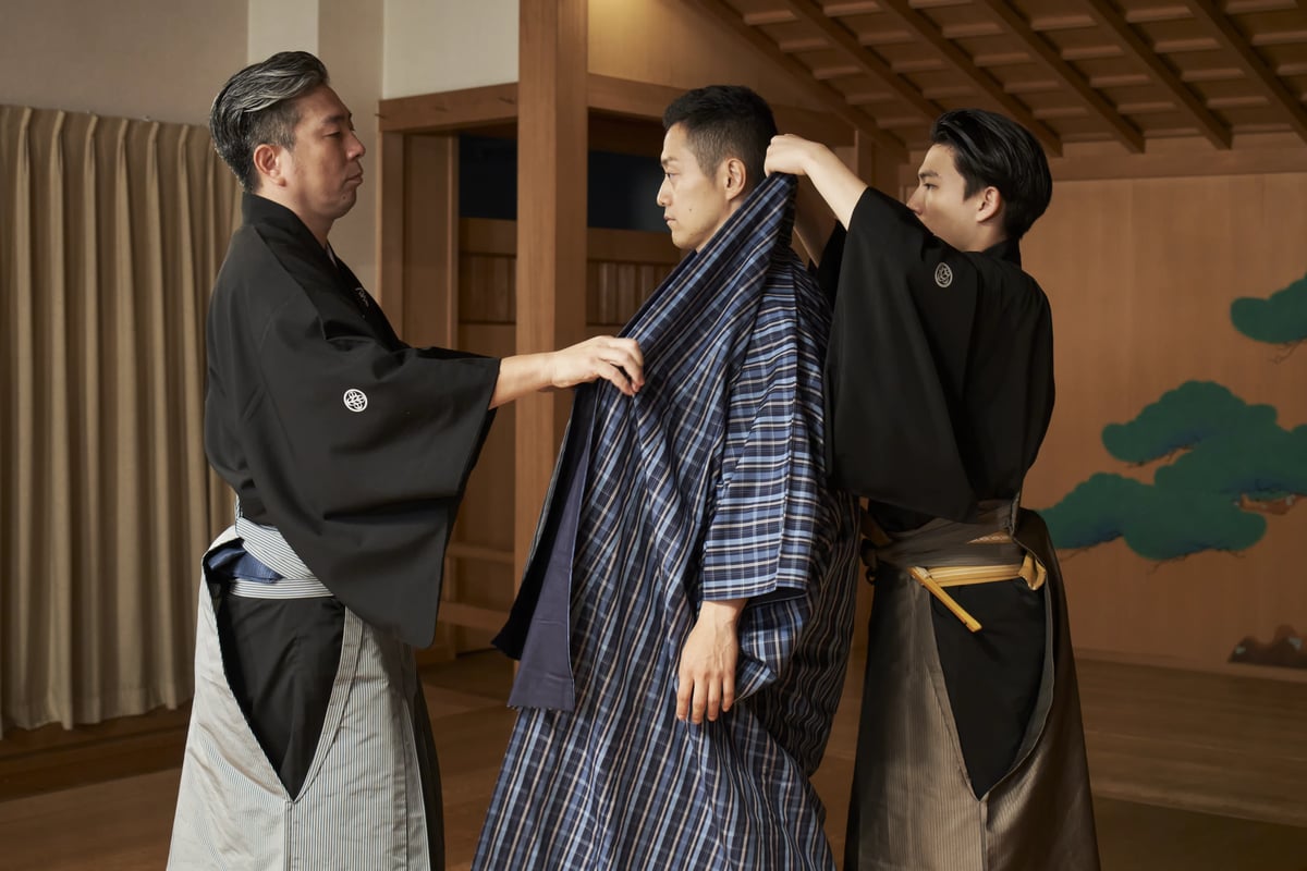 A visitor being dressed in kyōgen costume