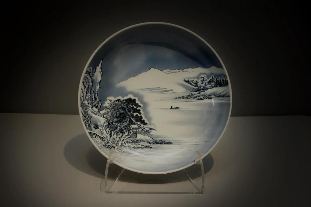 Imari porcelain plate with a painted landscape