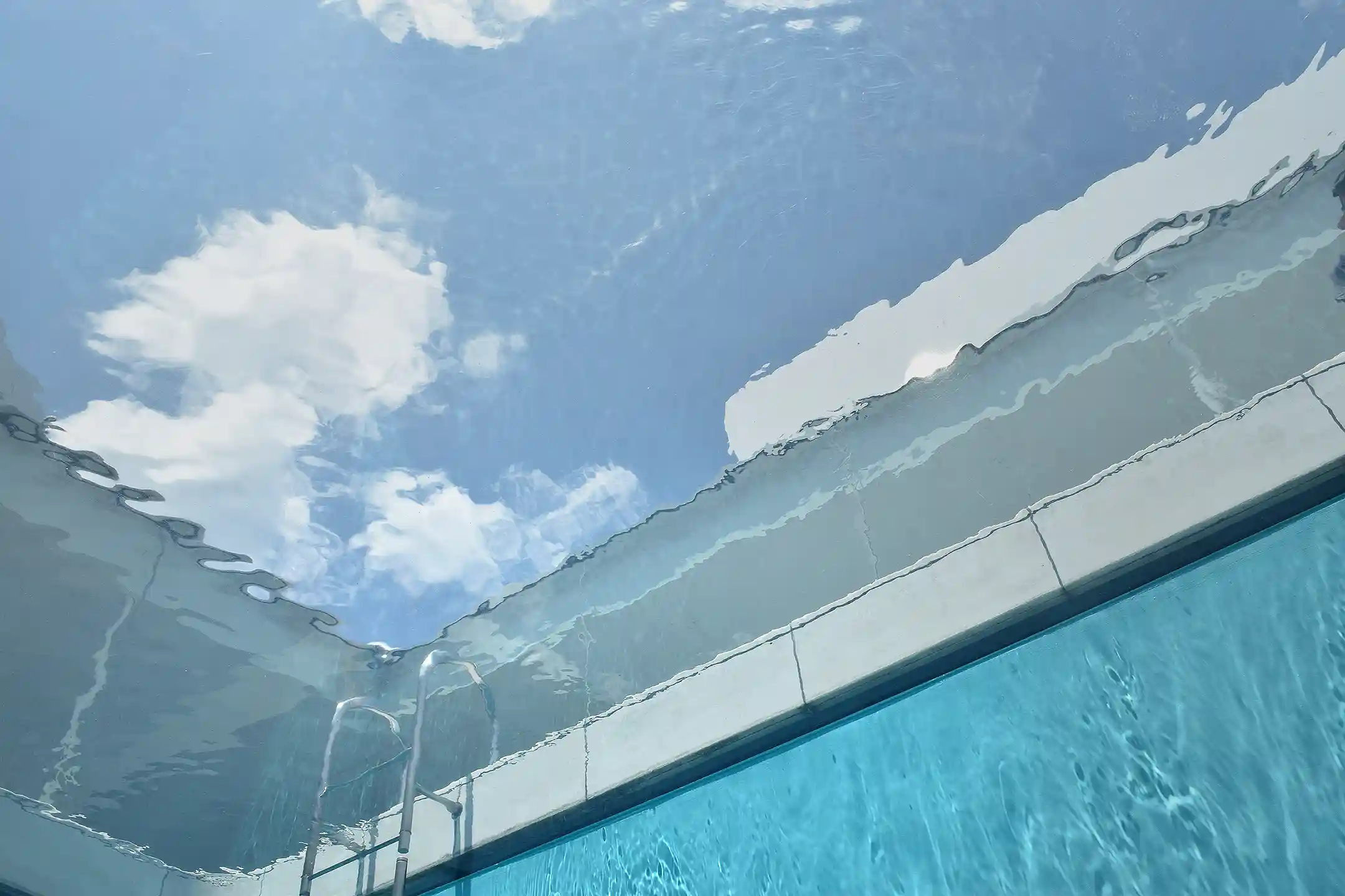 Looking up through the water of a museum installation in Kanazawa