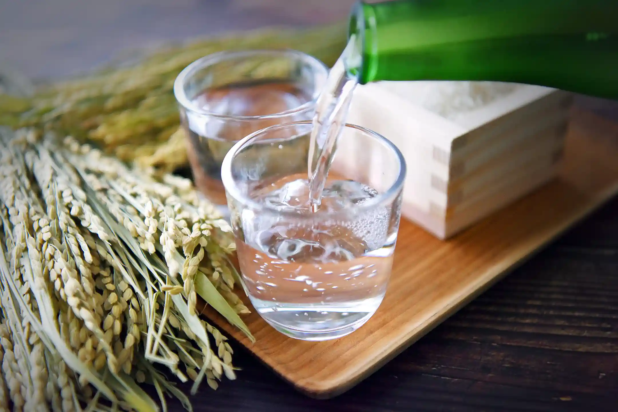 Sake poured beside rice stalks
