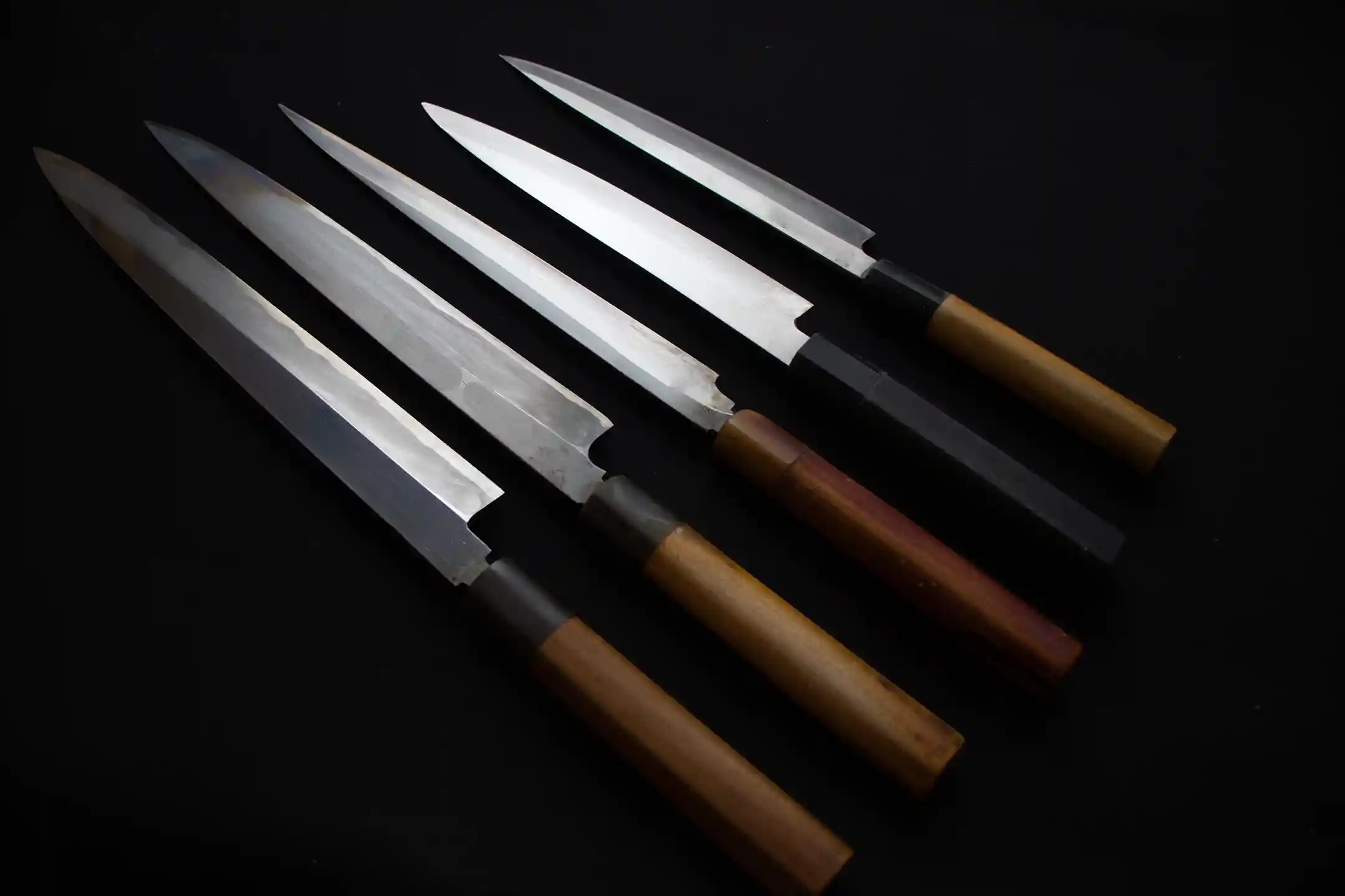 Single-bevel sashimi knives in a row